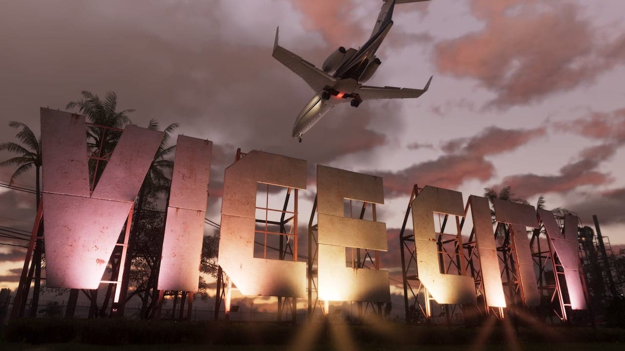 Aircraft flying over the Vice City sign at sunset